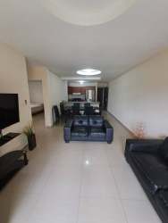 Open plan living and dining area with tile floors in David Chiriquí apartment for rent