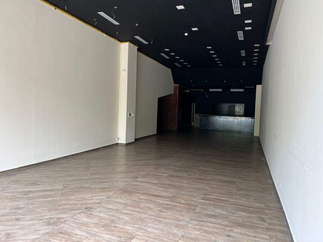 Unfurnished commercial lease unit dark ceiling wood tile floors Costa del Este