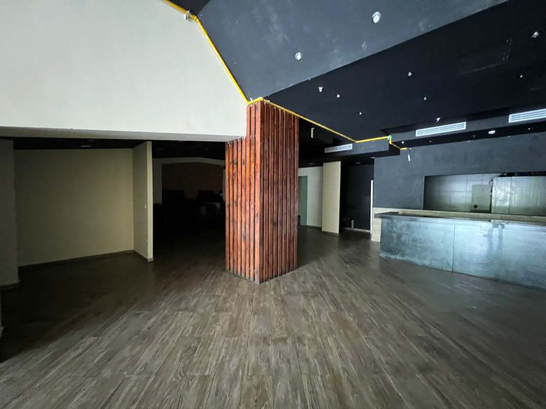 Wide commercial unit with dark ceiling wood finish floors Costa del Este