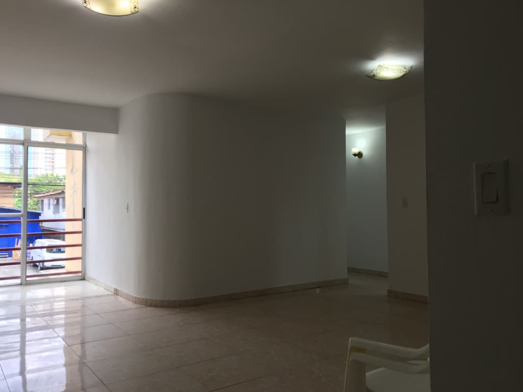 Bedroom with large window, ceramic tile flooring and closet in PH Via Porras San Francisco Panama