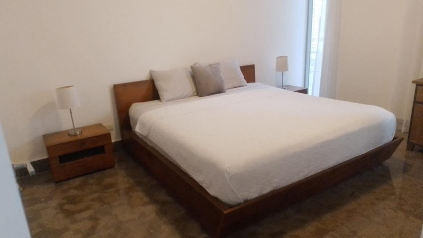 Marble dining area with modern furniture and large windows at Yoo Panama Ave Balboa