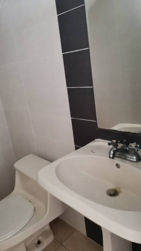 Standard kitchen area with cabinets and window in PH Los Alpes Panama