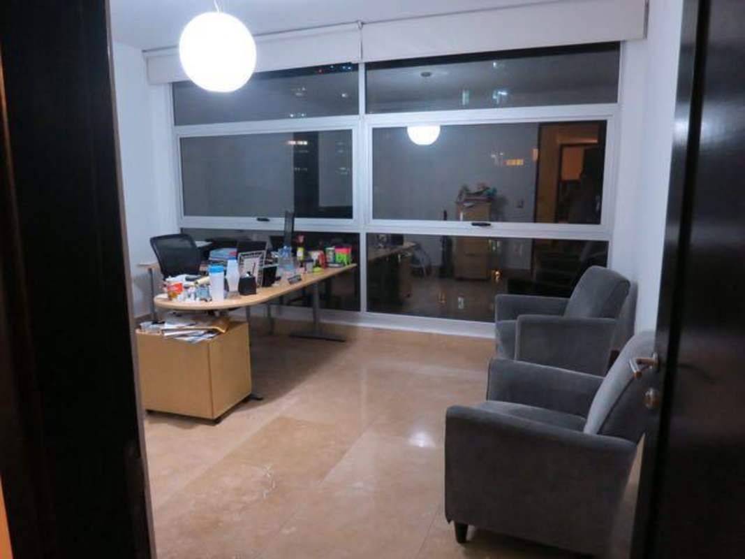 Elegant master bedroom with large windows and panoramic ocean views at PH Ocean Reef Panama City