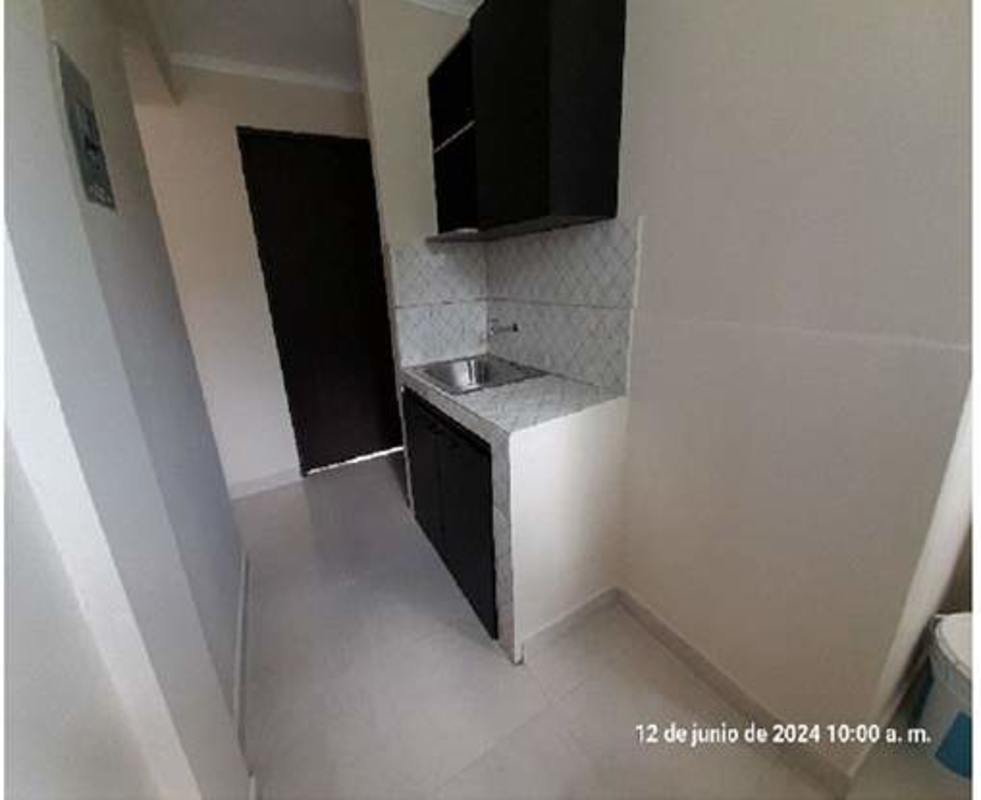 Bright bedroom with tiled floors and big window in Betania apartment for sale