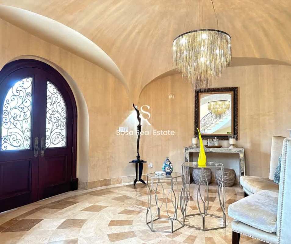 Modern gourmet kitchen, granite counters, island, high-end appliances in Costa del Este luxury house Panama