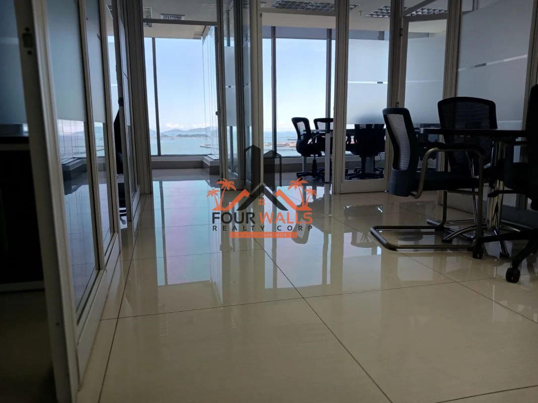 Private office with glass desk, executive chair large windows ocean view PH BICSA Panama
