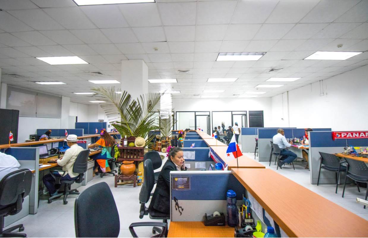 Modern open plan office area with cubicles and central dividers in Panama