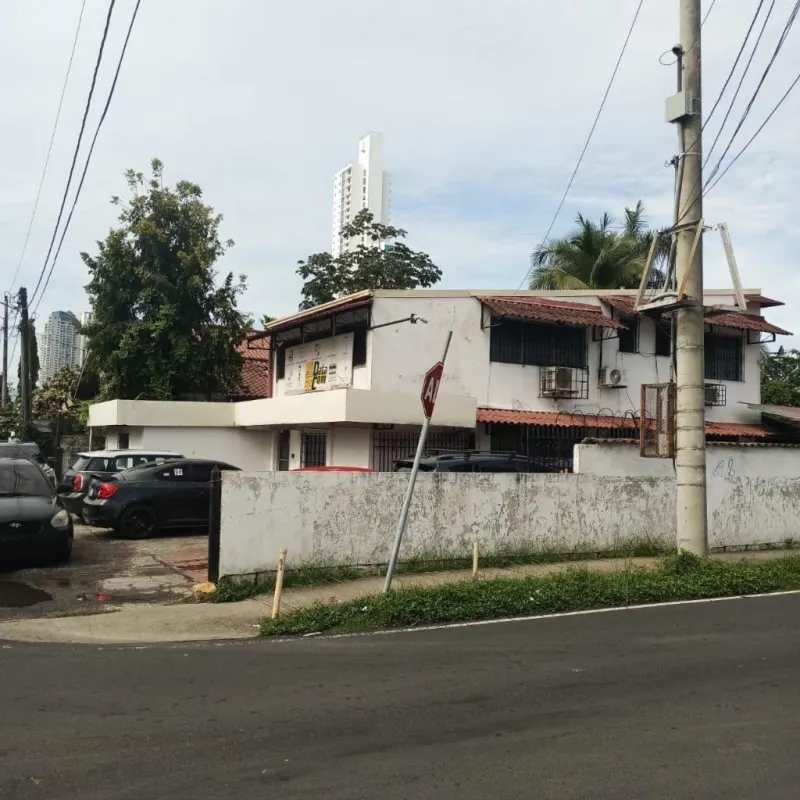 Exterior two-story building with tile roof parking and fenced yard in El Carmen San Francisco Panama