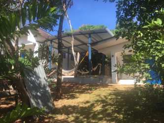 Beachfront residence with terrace, hammocks and Pacific Ocean views on Isla Gobernadora for sale Panama