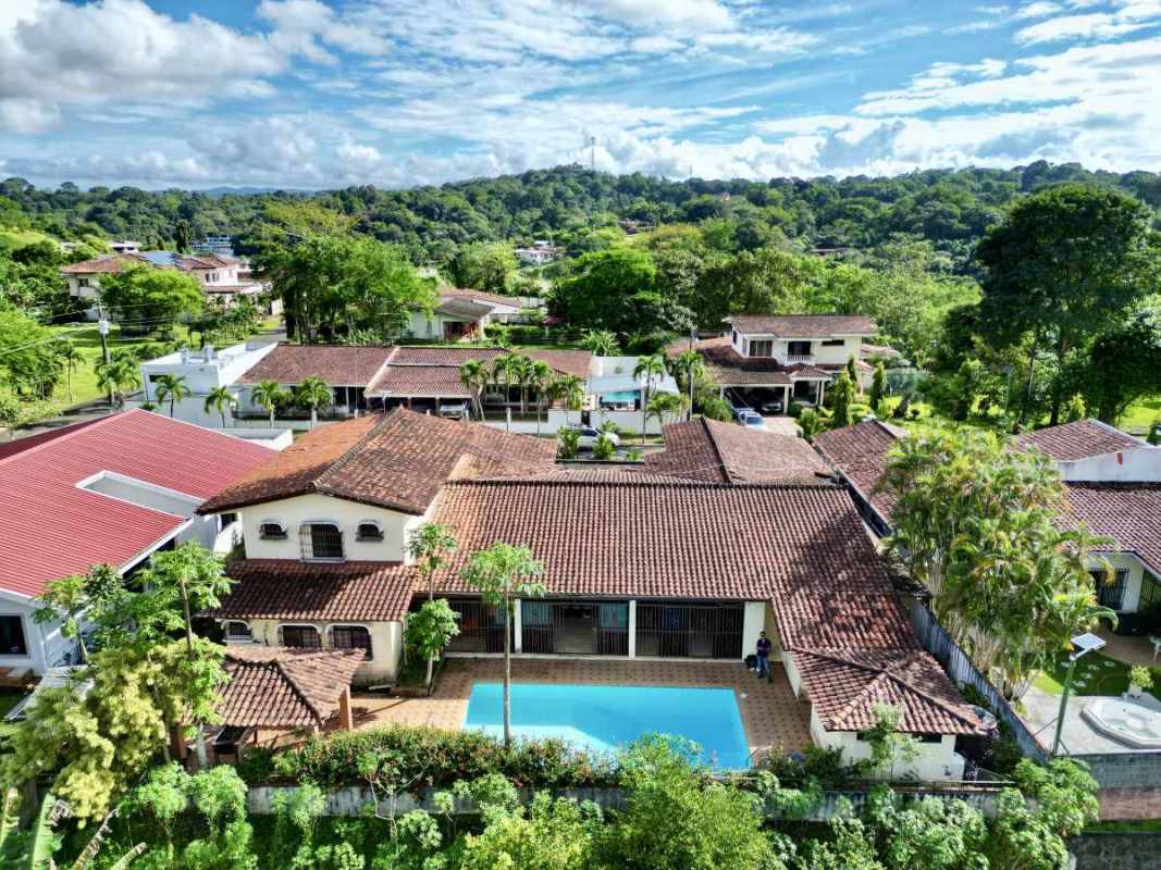 Spacious Mediterranean kitchen with wood cabinets, granite countertops, stainless appliances in Las Cumbres Panama