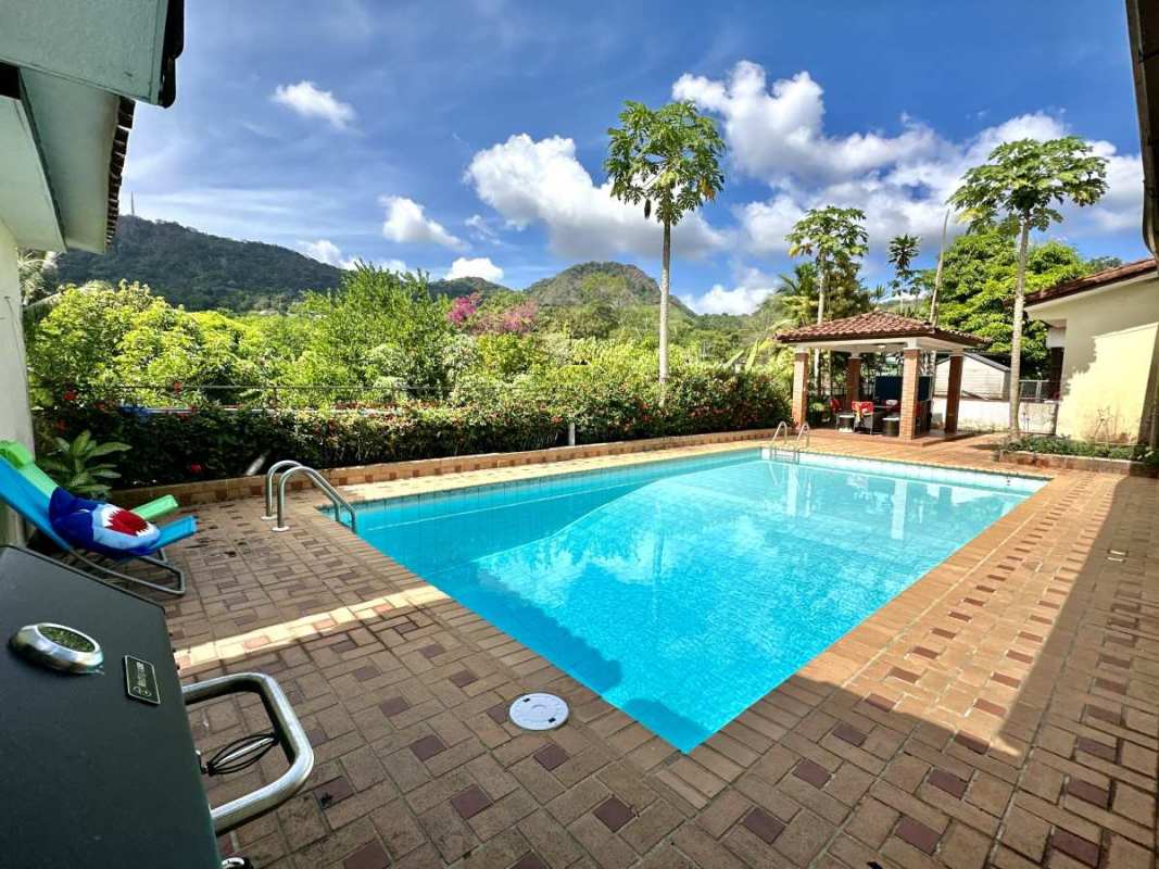 Patio with dining area, foosball table, next to pool and mountain views Las Cumbres