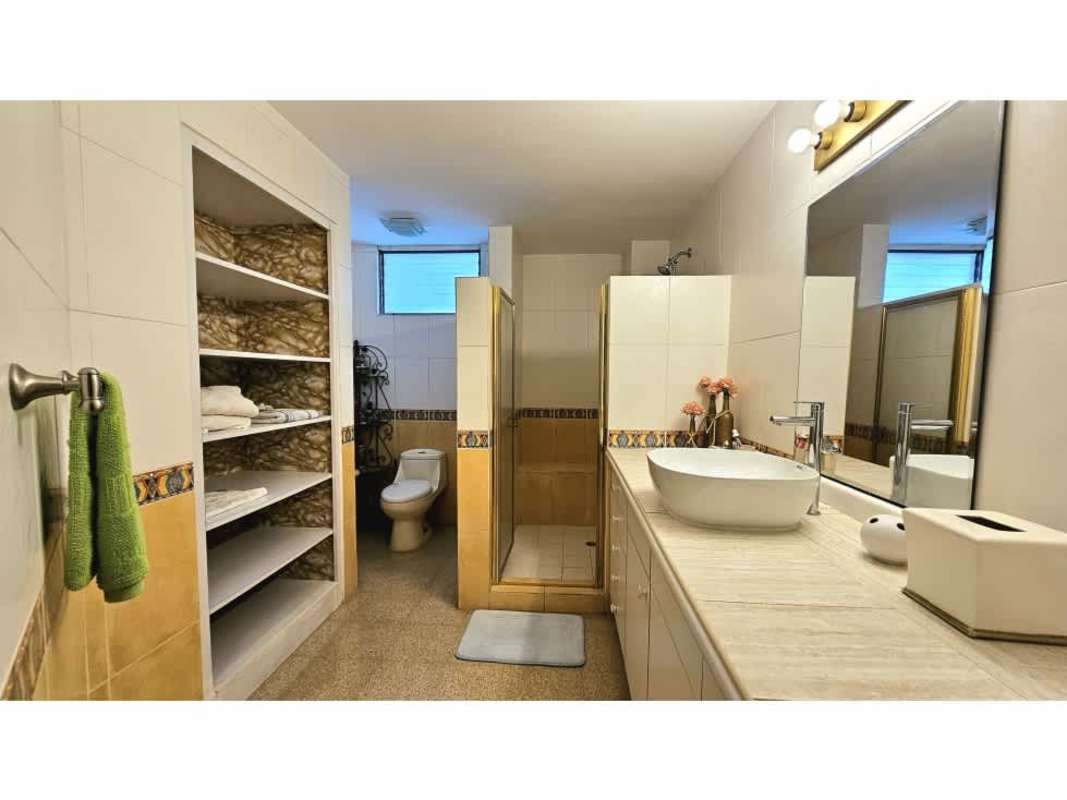 Dining room with ocean view windows furnished at PH Villa Magna Punta Paitilla Panama