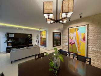 Dining space with large window and sea views at PH Mirador del Mar Coco del Mar Panama