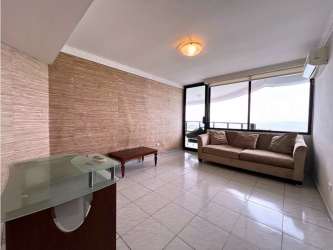 Contemporary living room with ocean view large windows in PH Crillon Paitilla Panama