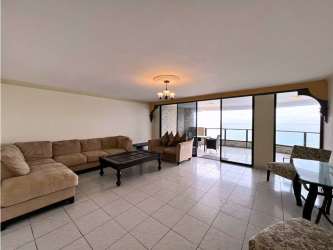 Spacious living room with access to balcony, large glass doors and ocean views in PH Crillon Panama