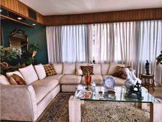 Large swimming pool with decorative waterfall in PH Marina del Rey Coco del Mar