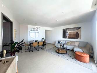 Bedroom with large windows, minimalist design, and city view PH Cranc Tower