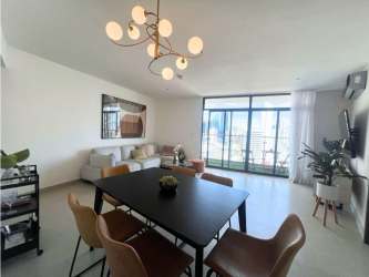 Open dining/living area with large windows and balcony access PH Cranc Tower Panama