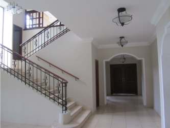 Exterior two-story Mediterranean style home with tile roof Camino de Cruces Panama