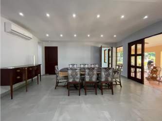 Terrace seating area views garden and pool Camino de Cruces luxury house for sale Panama