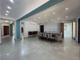 Dining room with natural light and garden access Camino de Cruces luxury house Panama City for sale