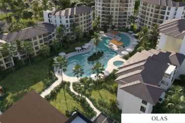 Sea-facing glass balconies with ocean views at Olas del Mar Playa Caracol