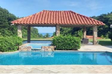 Traditional kitchen with central island, appliances and wood cabinetry Costa Esmeralda Panama