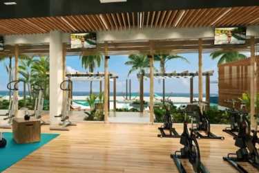 Resort style swimming pools amid palm trees at Surfside Playa Caracol Punta Chame Panama