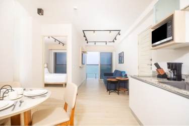 Modern living room with glass doors balcony and sea views in Surfside Condominium Panama