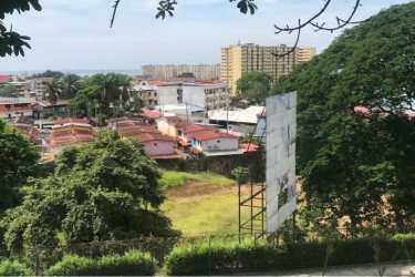 Mixed-use development area with apartment buildings greenery and billboards near Cerro Ancón Panama