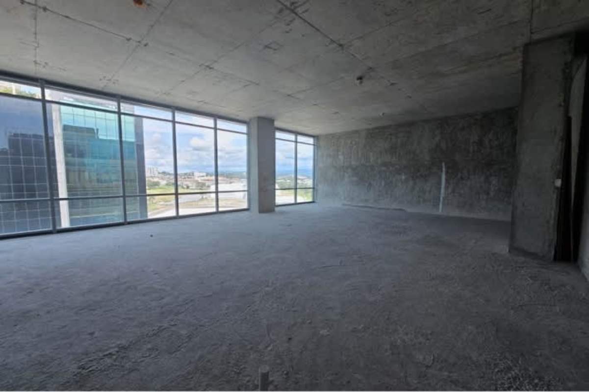 Unfinished commercial space with large glass windows city views PH Santa Maria Business District