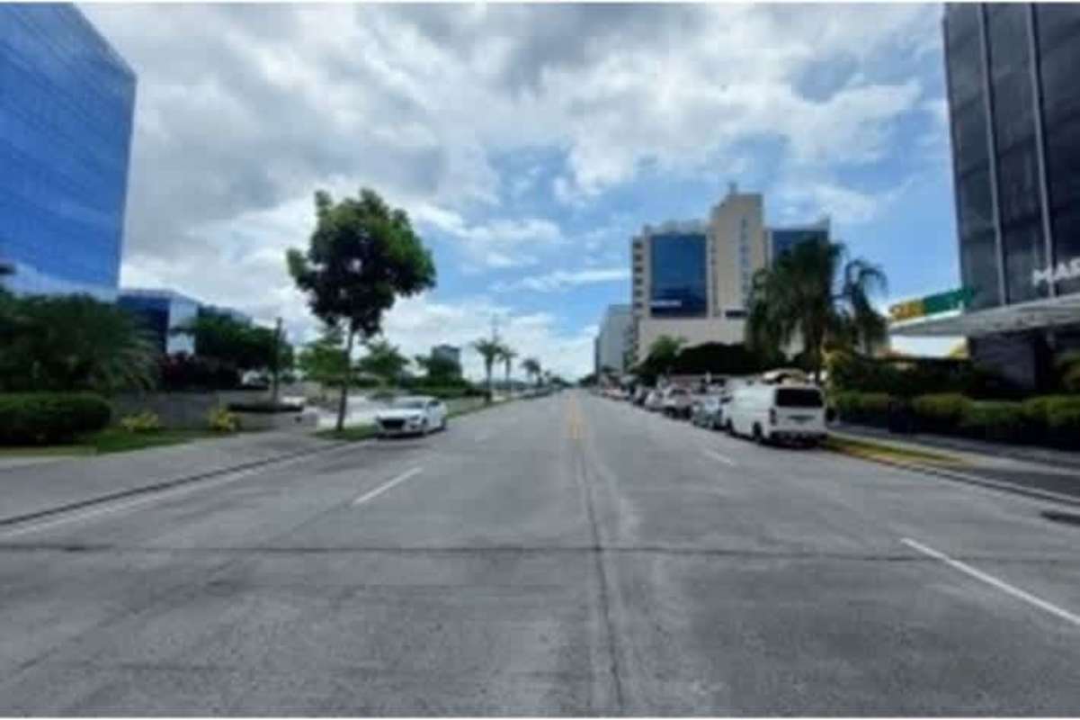 City street with modern office towers Santa Maria Business District Costa del Este Panama