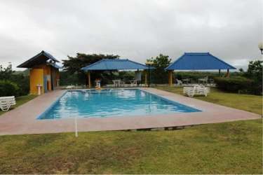 Large swimming pool with gazebos and lounge area in Hacienda La Florenciana San Carlos