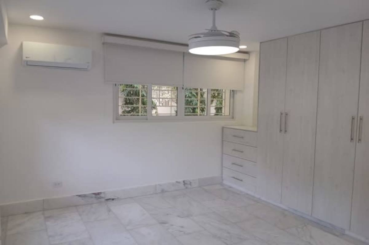 Spacious living room with marble floors large windows modern lighting luxury house Altos del Golf Panama