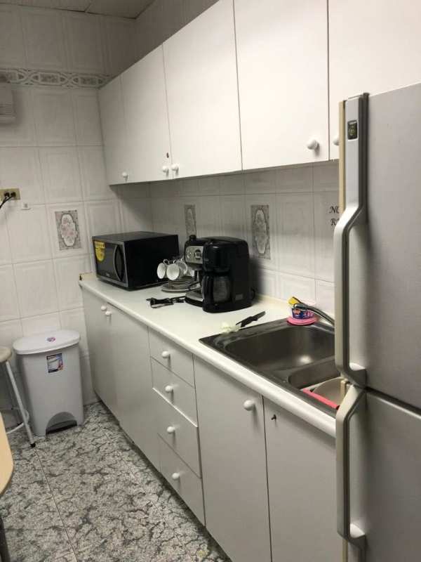 Compact traditional kitchenette with appliances in PH Omega Obarrio Panama City