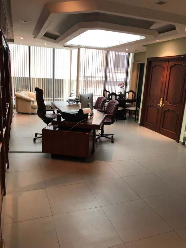 Modern office with executive area, conference table, large windows in PH Omega Panama City