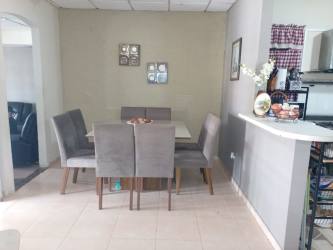 Modern dining room area with neutral walls and tiled floors in La Chorrera