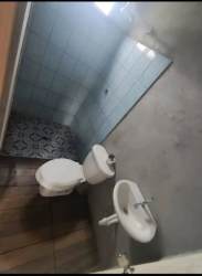 Simple bathroom with toilet and blue tiles Cordillera Panama