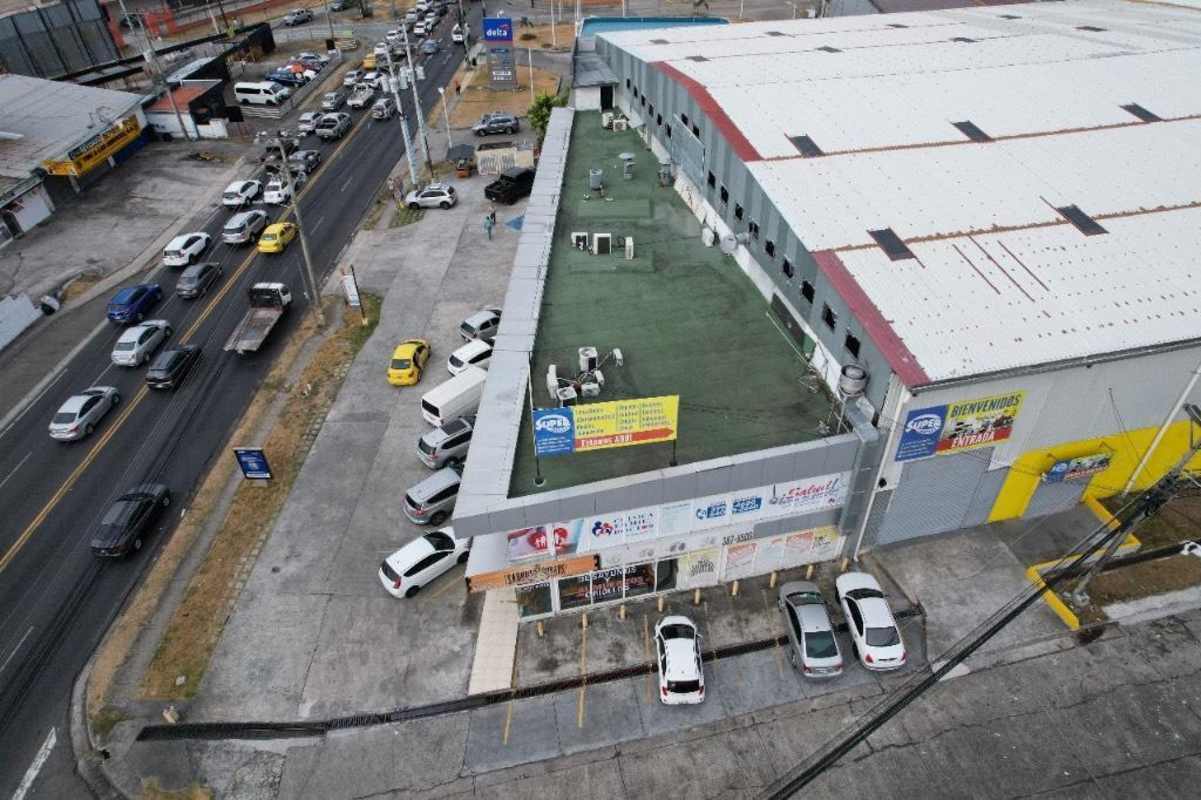 Aerial shot of commercial plaza with parking lot along Campo Limberg Panama City
