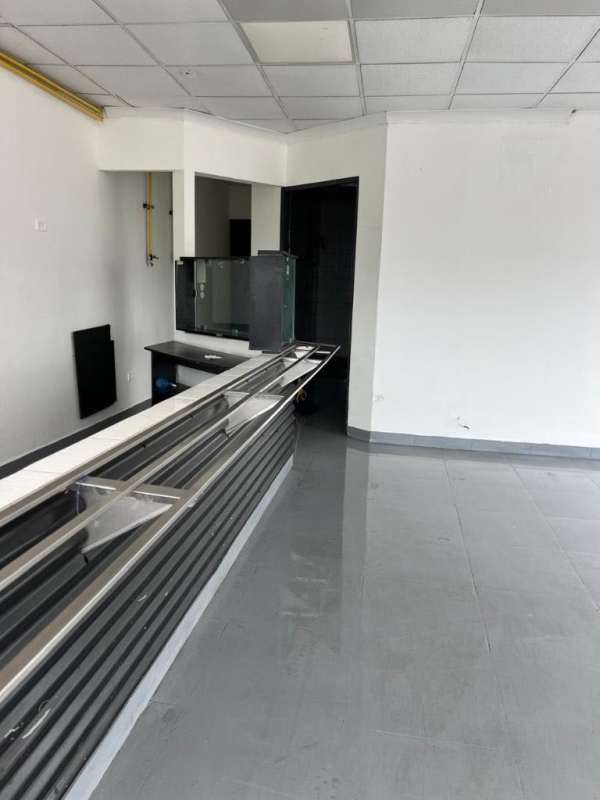 Interior of commercial unit with glossy tiled floor, white walls and open plan in Panama
