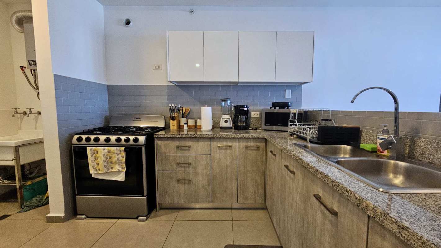 Modern bedroom with large wardrobe and window city view PH La Cresta Panama