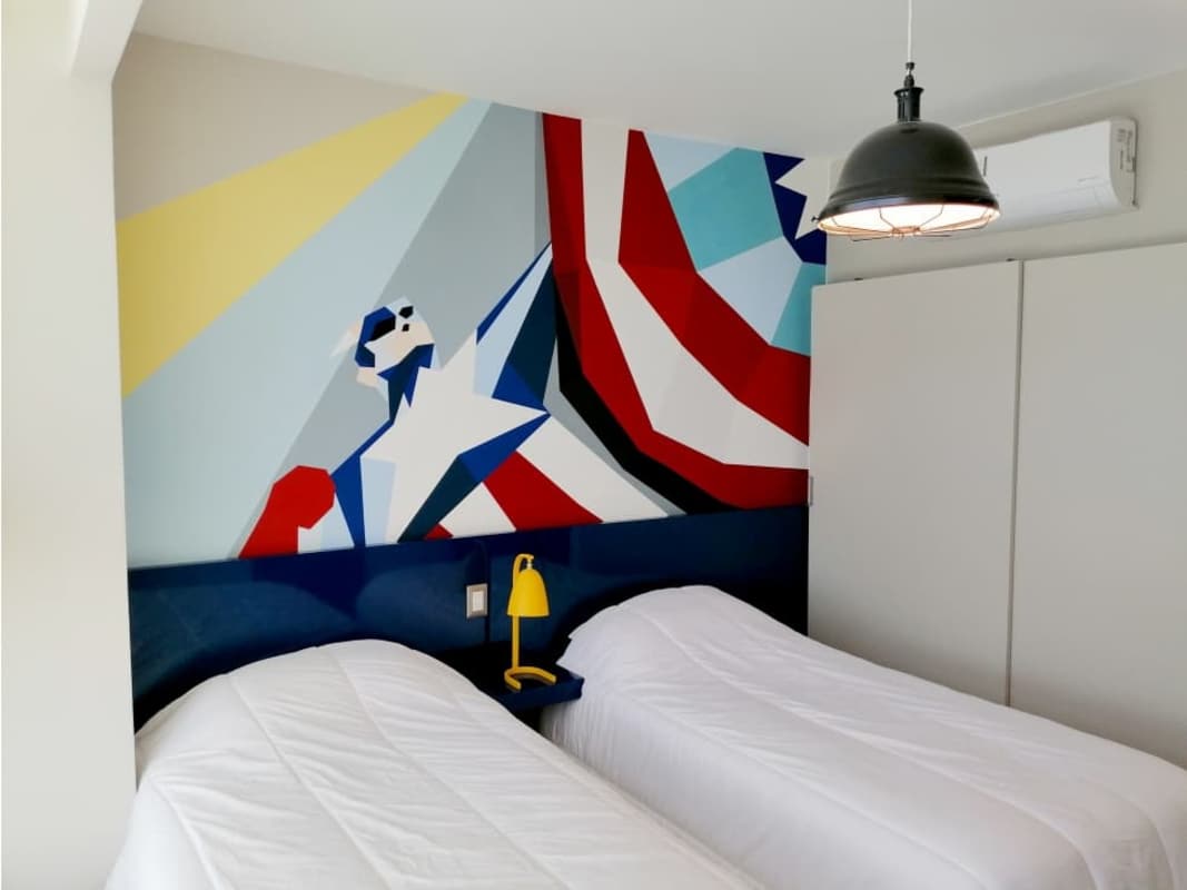 Twin bed bedroom with pop art mural and AC in PH Bali Costa del Este Panama