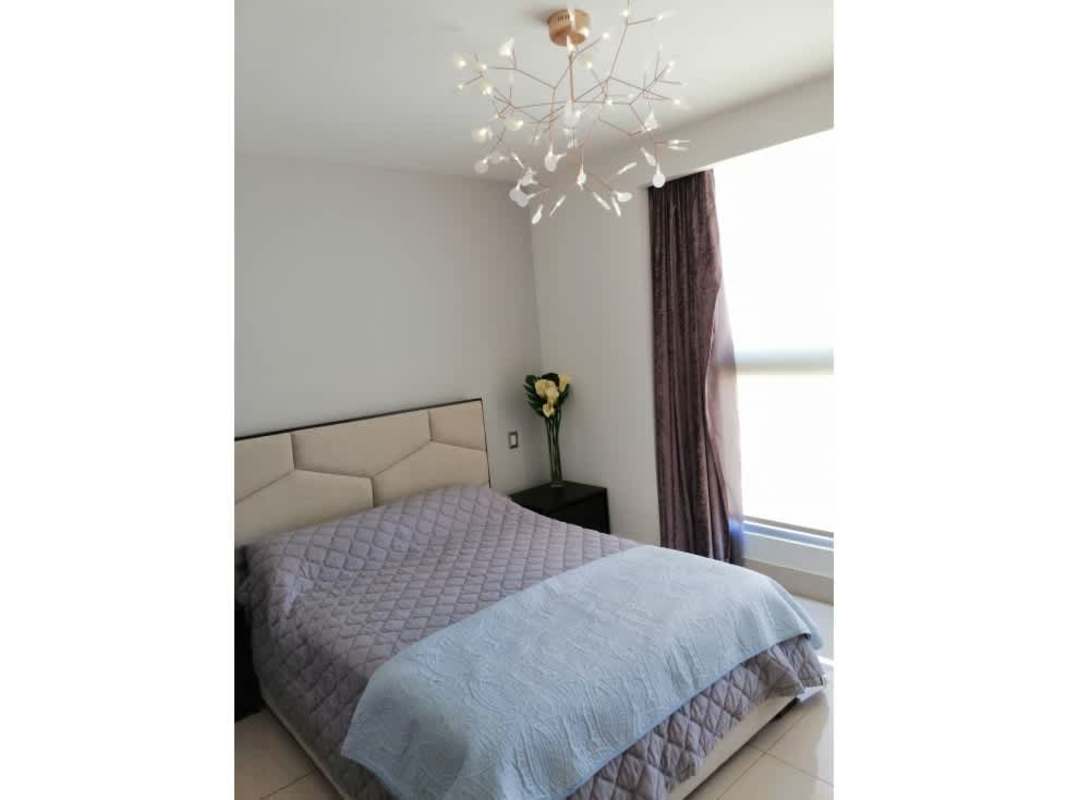 Modern bathroom with vessel sink stone countertop and large mirror at PH Bali Costa del Este