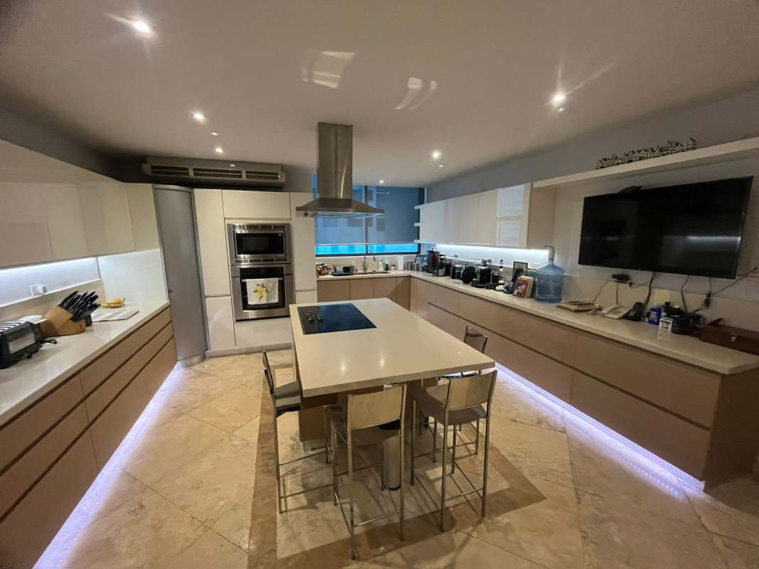 Modern kitchen with island, luxury finishes, and built-in appliances in PH Ocean Park Panama City
