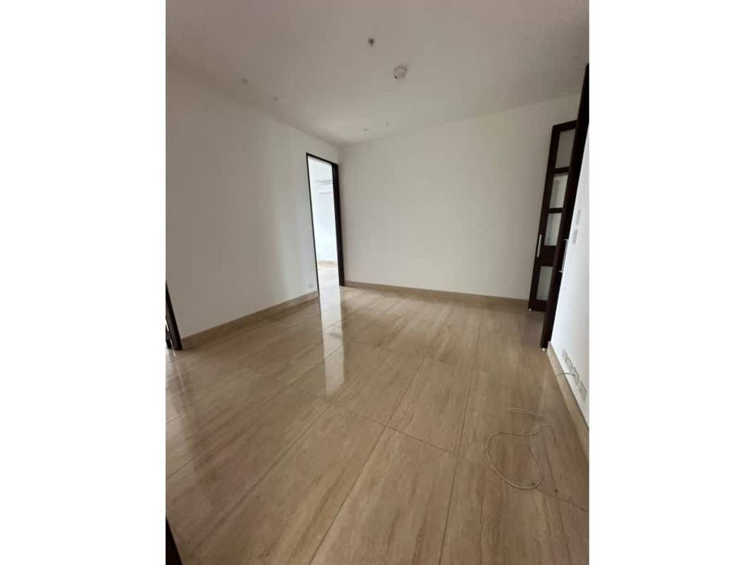 Elegant bedroom with marble floors, large window, city skyline view PH Solana Santa Maria Panama