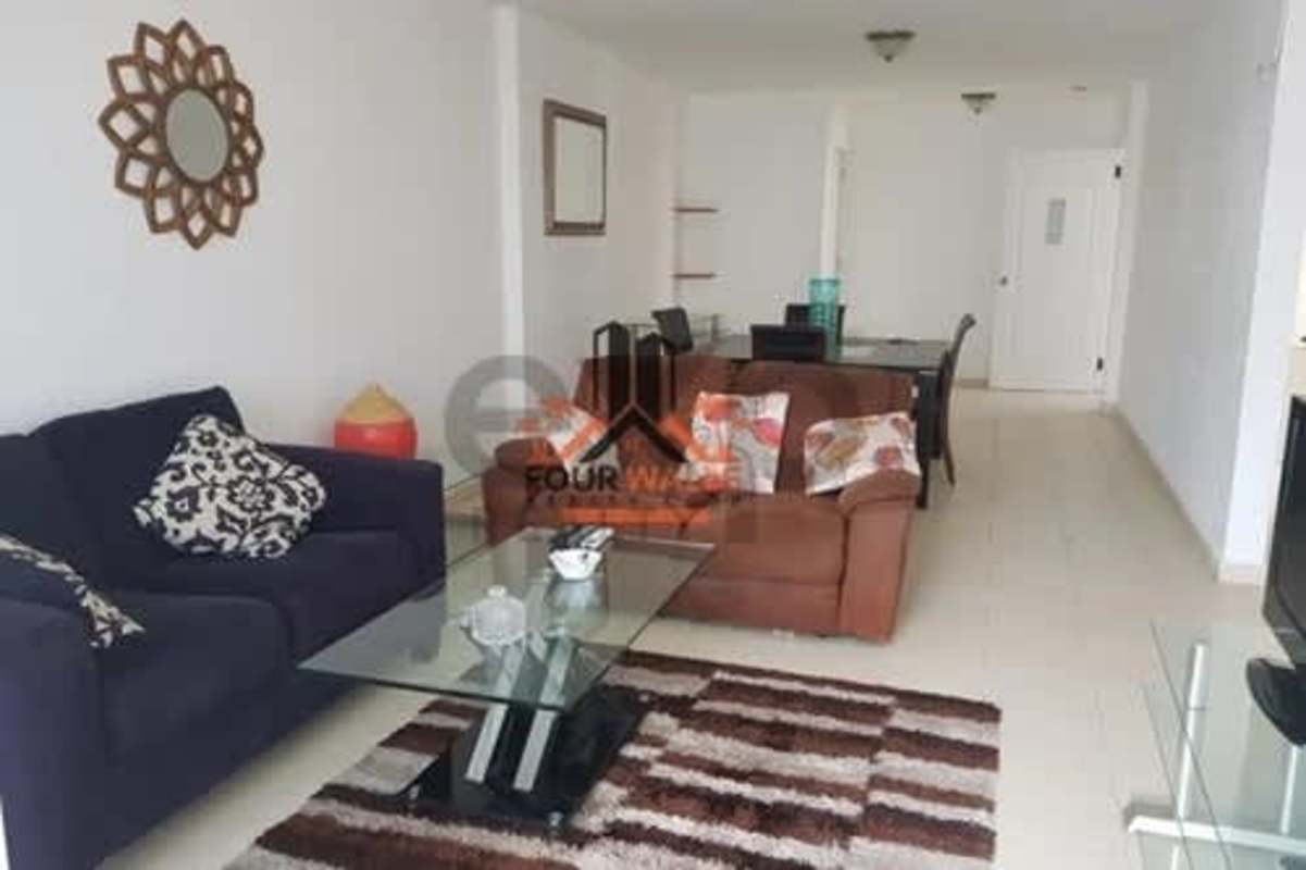 Spacious living and dining area with glass tables and contemporary decor in PH Plaza 77 El Cangrejo Panama City