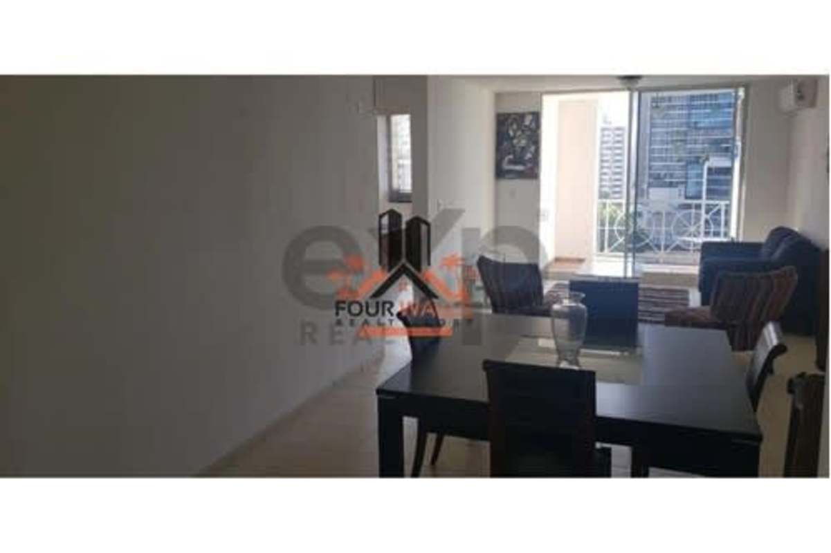 Modern living room with balcony overlooking Panama City skyline in PH Plaza 77 El Cangrejo