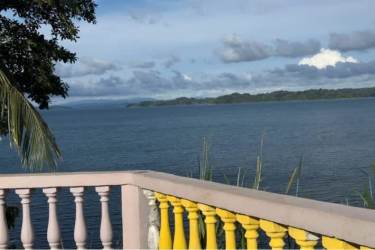 Balcony railing overlooking panoramic view of Gatun Lake with distant islands in Escobal Colón Panama