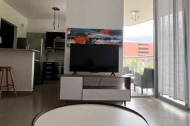 Open living area opening to private terrace with outdoor seating at Panama Pacifico condos