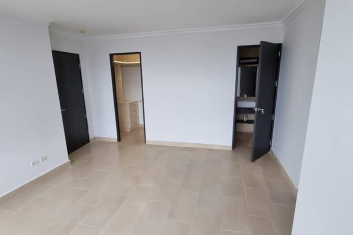 Master bedroom with walk-in closet, ensuite bathroom, large windows and ocean views in Pacific Point Tower Panama